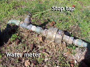 Water meter and stop tap